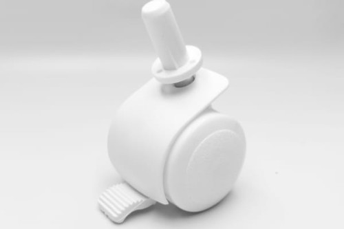 Kółka do łóżeczka białe. Widok na jedno kółko.